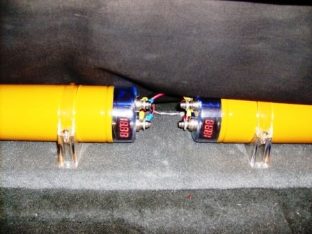 One farad capacitors in trunk